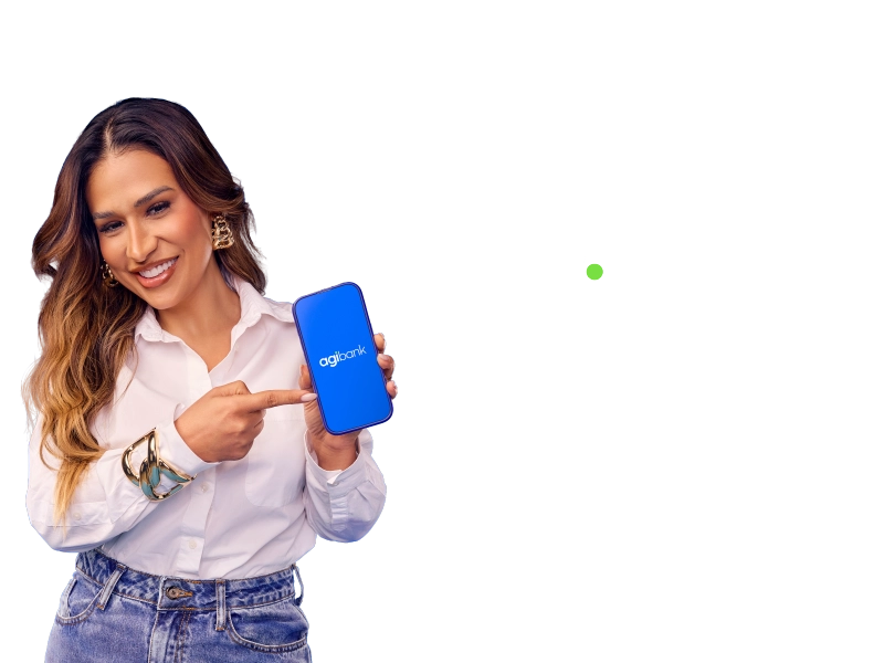 Simone segura um celular com o logotipo do Agibank na tela, apontando para ele. Ao lado, em letras brancas em fundo preto, está o texto "Muda Pro Agibank"